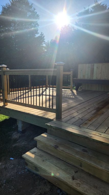 New wood deck with railing and steps